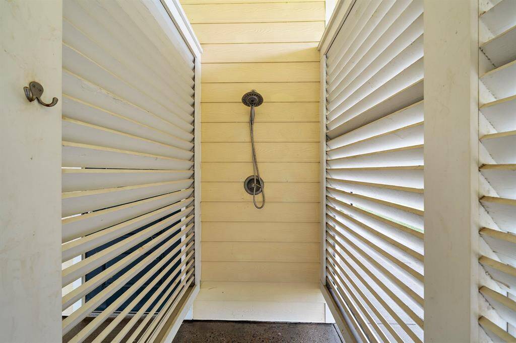 Outdoor shower to keep the sand from going upstairs.