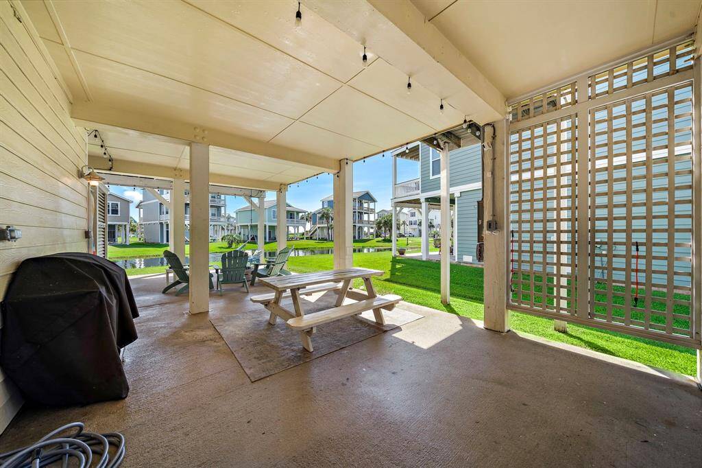 Ample room for outdoor entertaining.. with edison lights and a mosquito misting system.