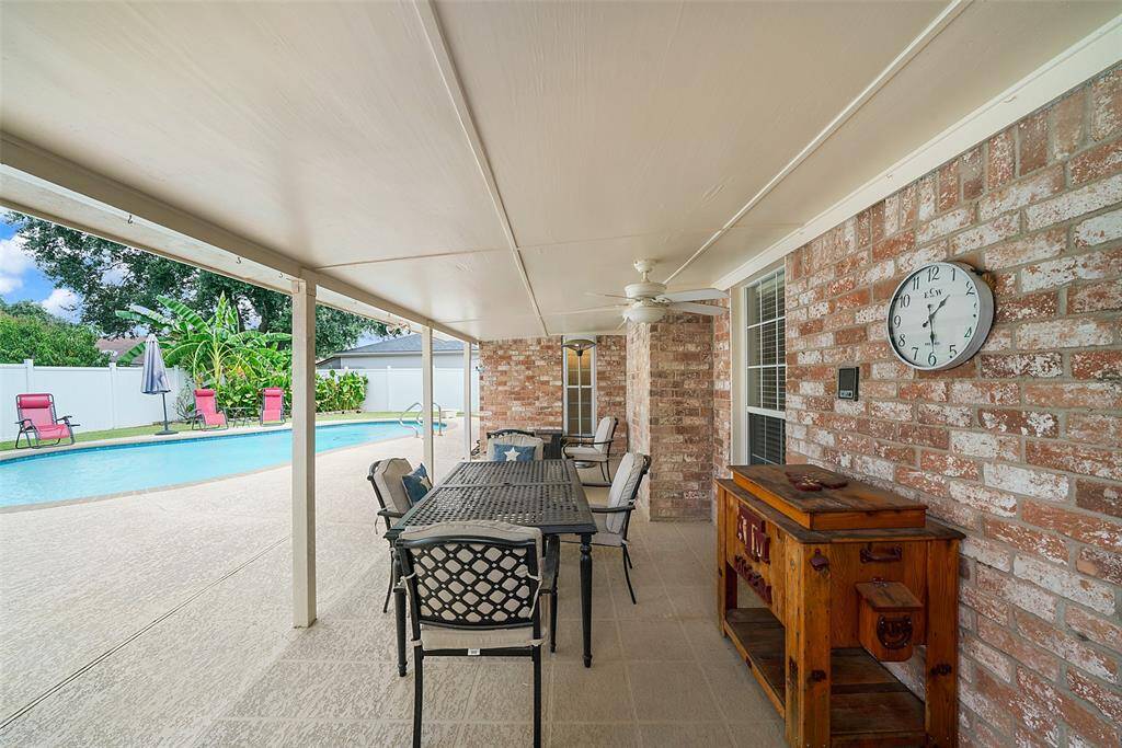 This patio has room for a large table and as you can see the home has 4 sided brick.