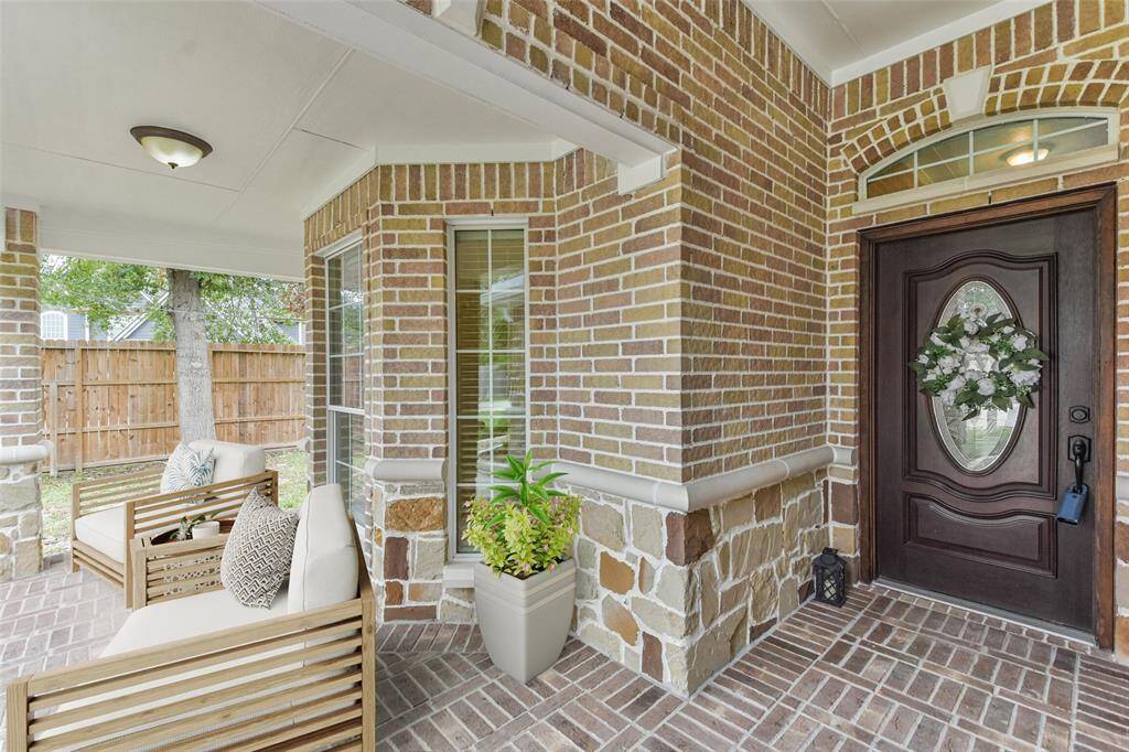 Enter to a covered front patio perfect for enjoying your morning coffee