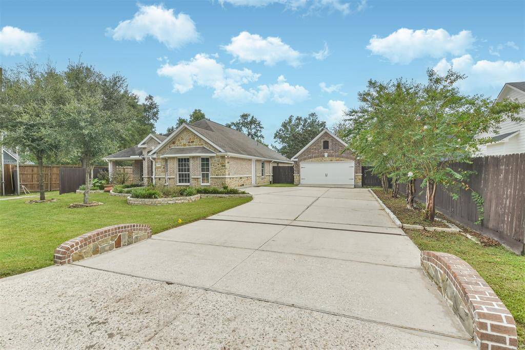 Stunning single-story home featuring a captivating brick and stone elevation located on a 0.413 acre lot