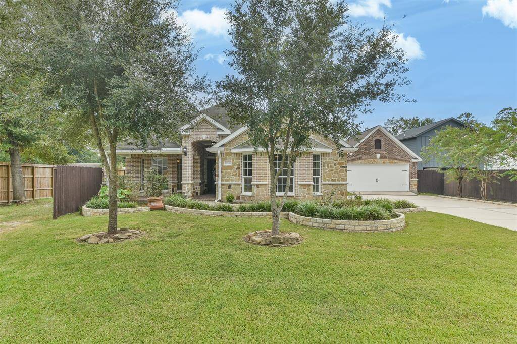 Stunning single-story home featuring a captivating brick and stone elevation located on a 0.413 acre lot