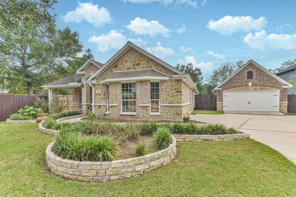 Stunning single-story home featuring a captivating brick and stone elevation located on a 0.413 acre lot