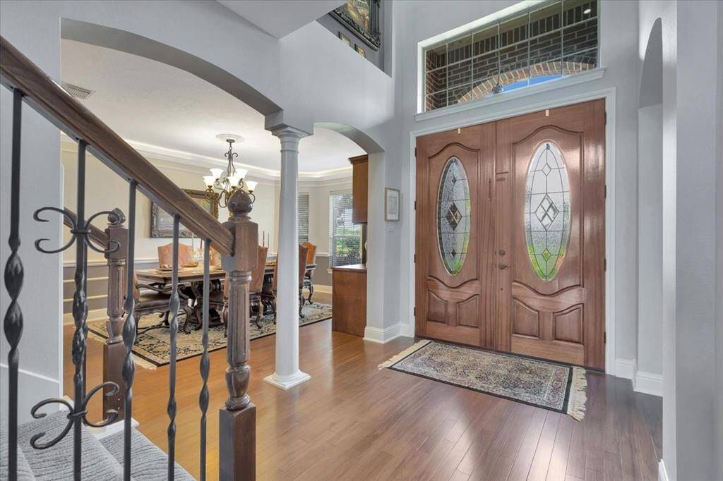 View of grand entrance showing off the large dining room.