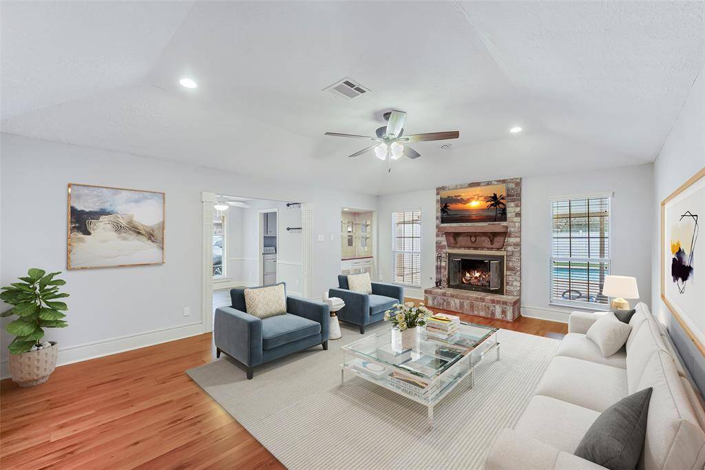 Family room is warm an inviting! Virtually staged