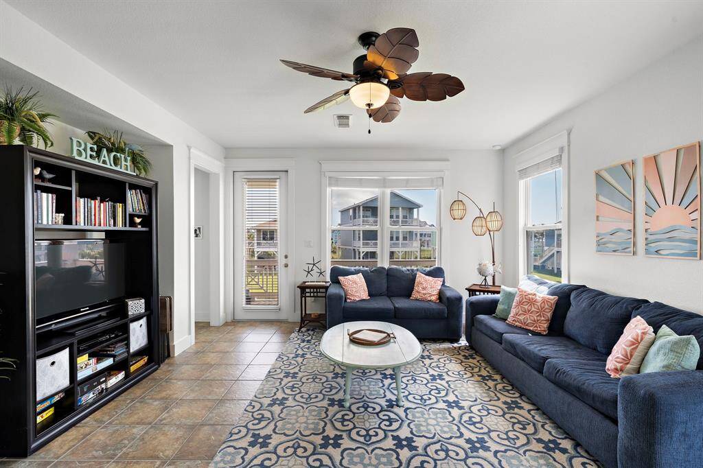 Another angle showing access to the patio from both the living room and the primary suite.