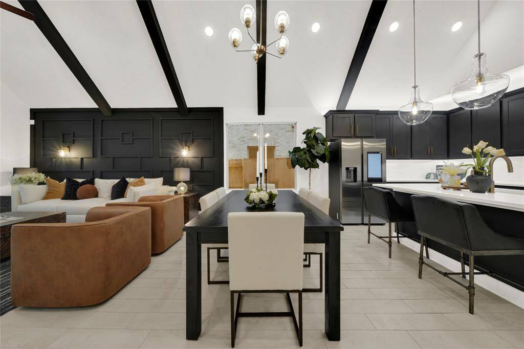 The dining area between the kitchen and living room is spacious enough for a large table and chairs