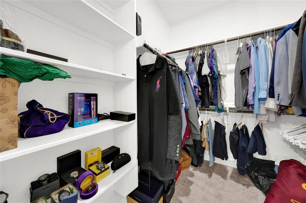 One of two primary closets located in the bathroom