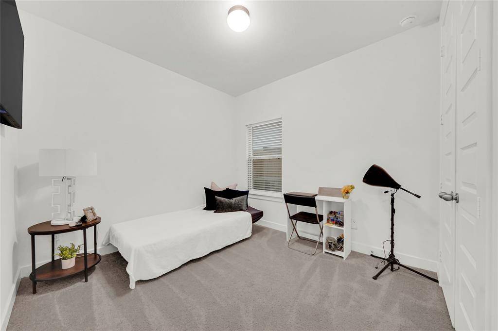 Second downstairs bedroom is also perfect for a craft room or home office.