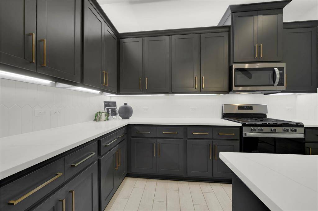 The under-cabinet lighting adds a warm touch, enhancing the contemporary design.