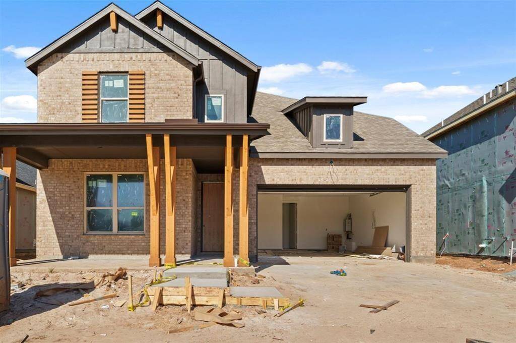 Inviting covered front porch sets the tone for this warm and welcoming home.