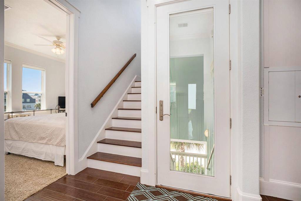 Back door with staircase to the second floor