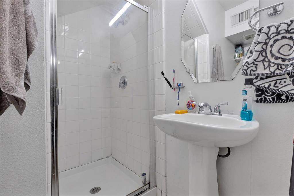 A third full bathroom with a shower/tub combo.