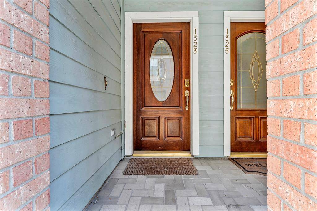 This is a cozy outdoor patio area with a stone paver floor. The perfect place for your morning coffee!