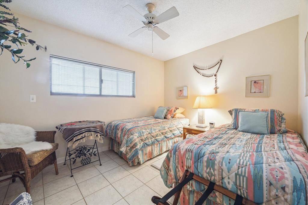 Secondary bedroom is spacious and also includes an ensuite bath.