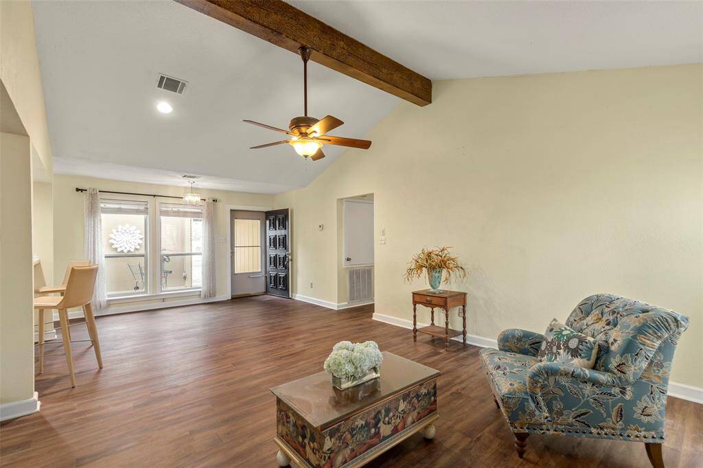 Spacious living area with views of the courtyard and front entry.
