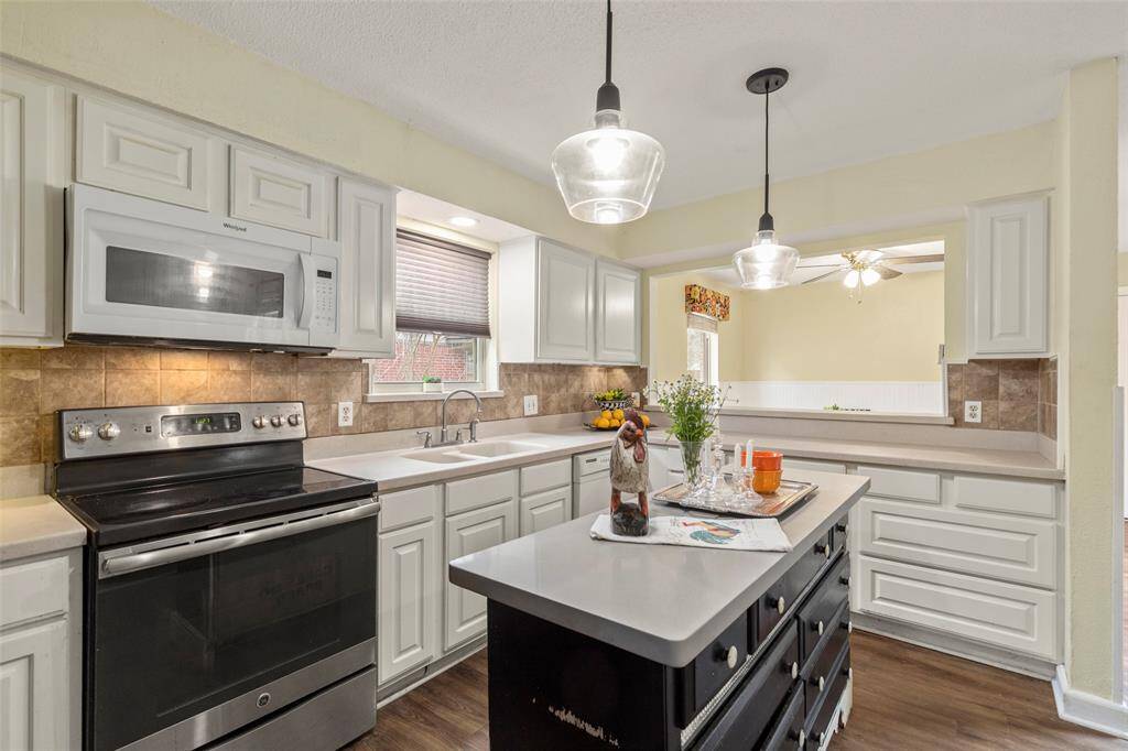 Another view of the kitchen with opening to breakfast room, lots of storage.