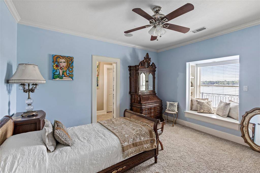 Guest Bedroom with ensuite bathroom and window views of Lake Conroe.