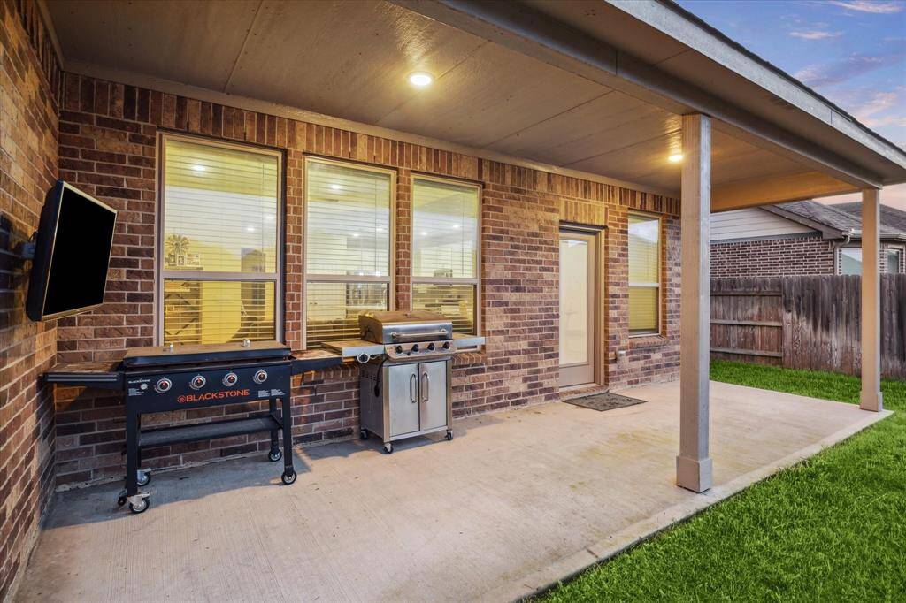 Enjoy evenings relaxing on your covered patio overlooking the spacious back yard.
