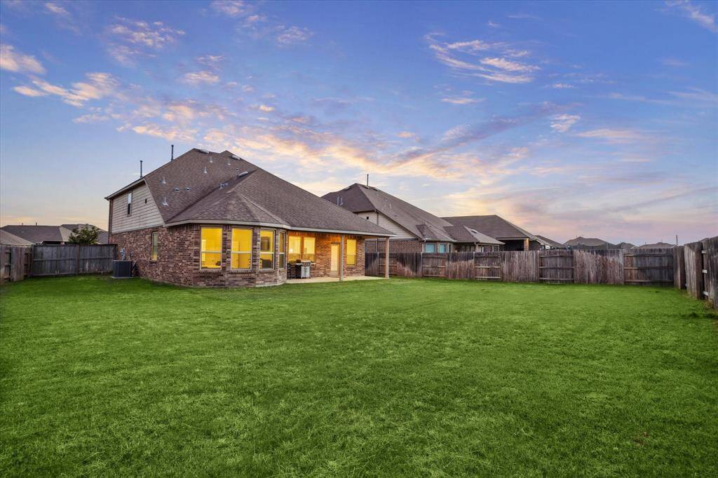 Another view of the rear yard and side yard at twilight.  Beautiful neighborhood affording a wonderful lifestyle with great neighbors (they told me to say that), great friends and awesome memories.