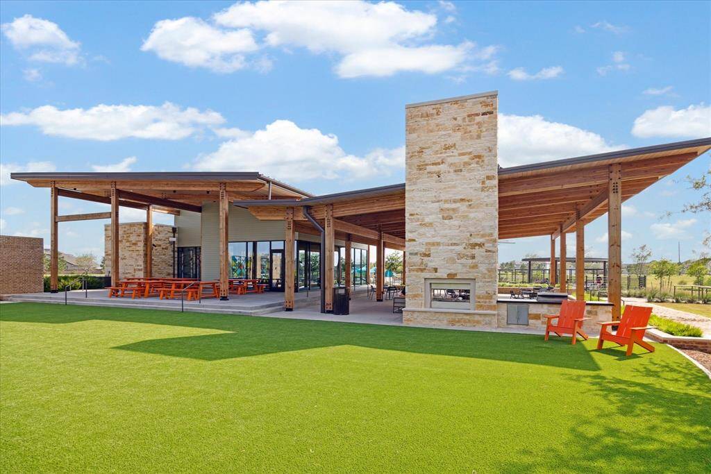 View of the covered patio area along with picnic tables to enjoy the outdoors.