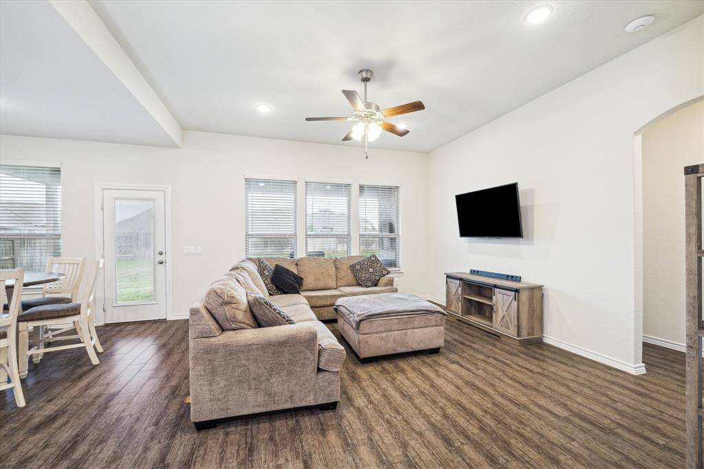 View of the inviting and comfortable gathering room that radiates warmth and hospitality. The high 10 foot ceiling emphasizes spaciousness.