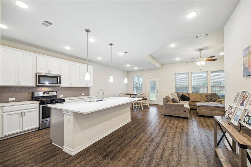 Here is a view of the kitchen showing the breakfast/dining room and how this area is open to the Den/family room. Very efficient style.
