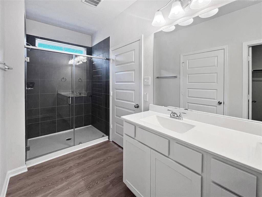 Owner's Bathroom with Walk-in Shower and Dual Sinks