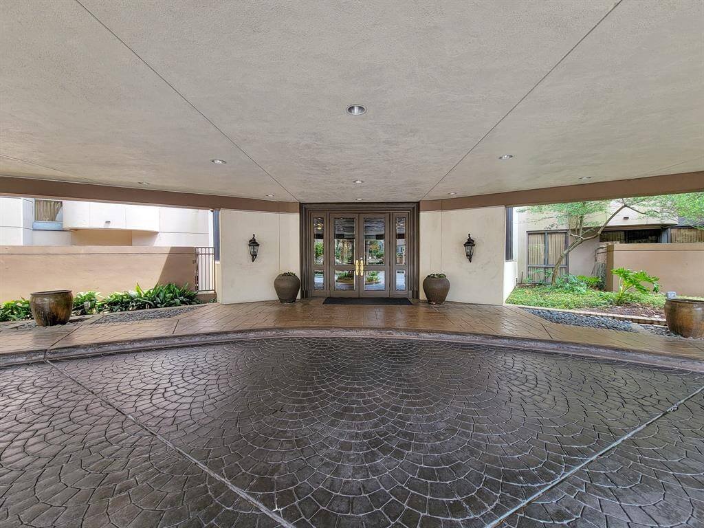 Rich, designer-stamped driveway entrance.