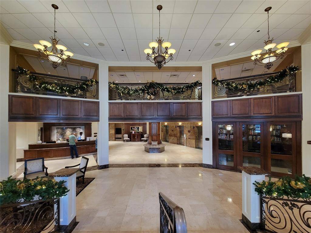 Worldly Lobby with 24 hour Concierge and Inviting Mezzanine Overlook