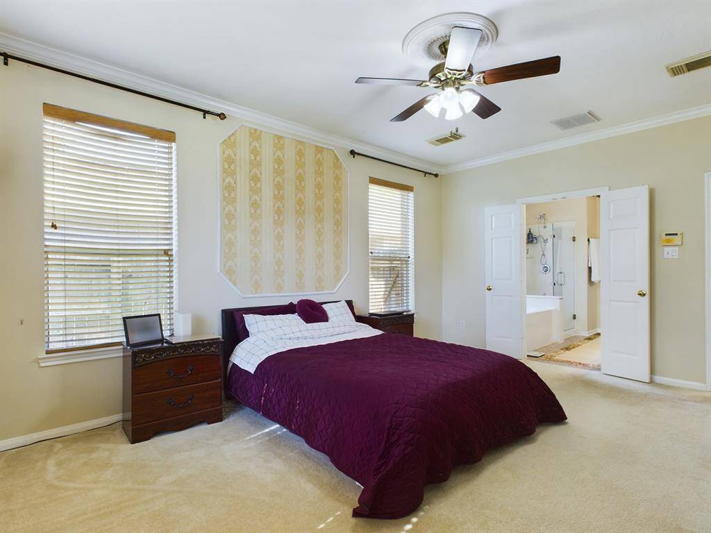 Double doors lead to the bathroom on-suite