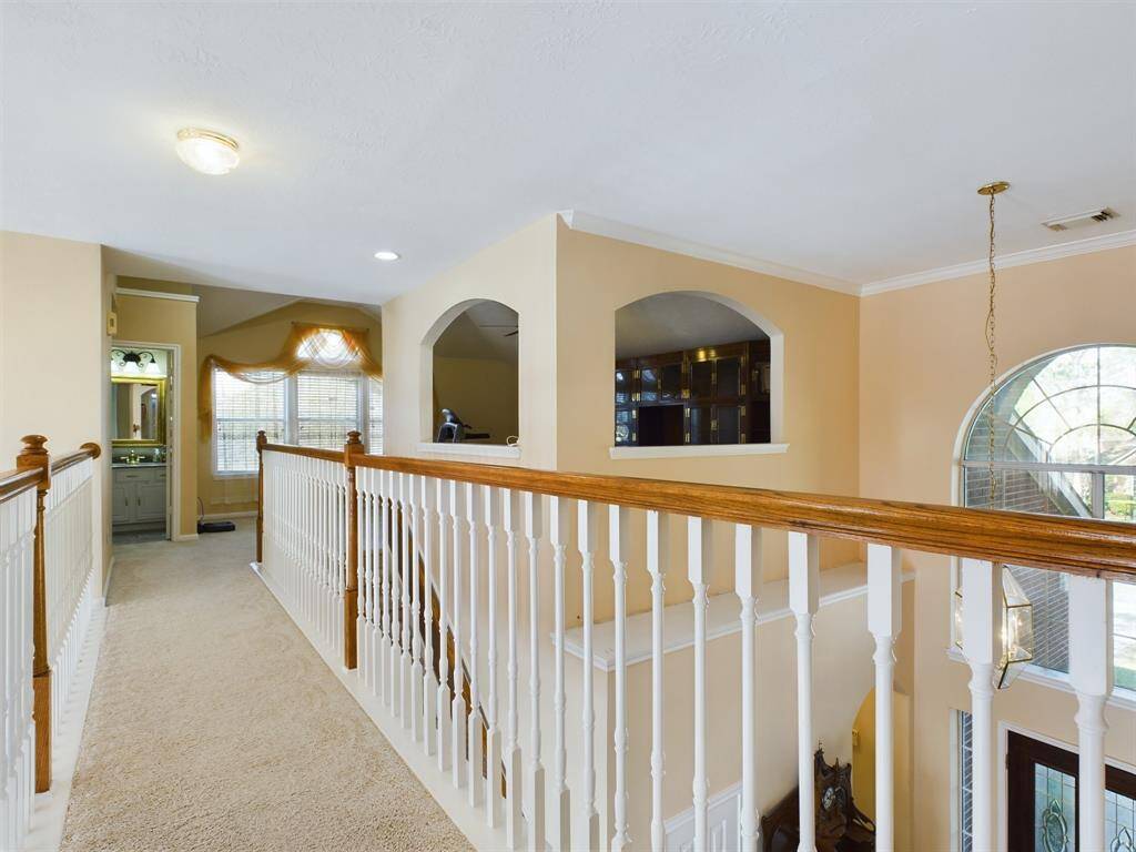 Catwalk separates the game room from the 2 additional bedrooms and third bathroom.