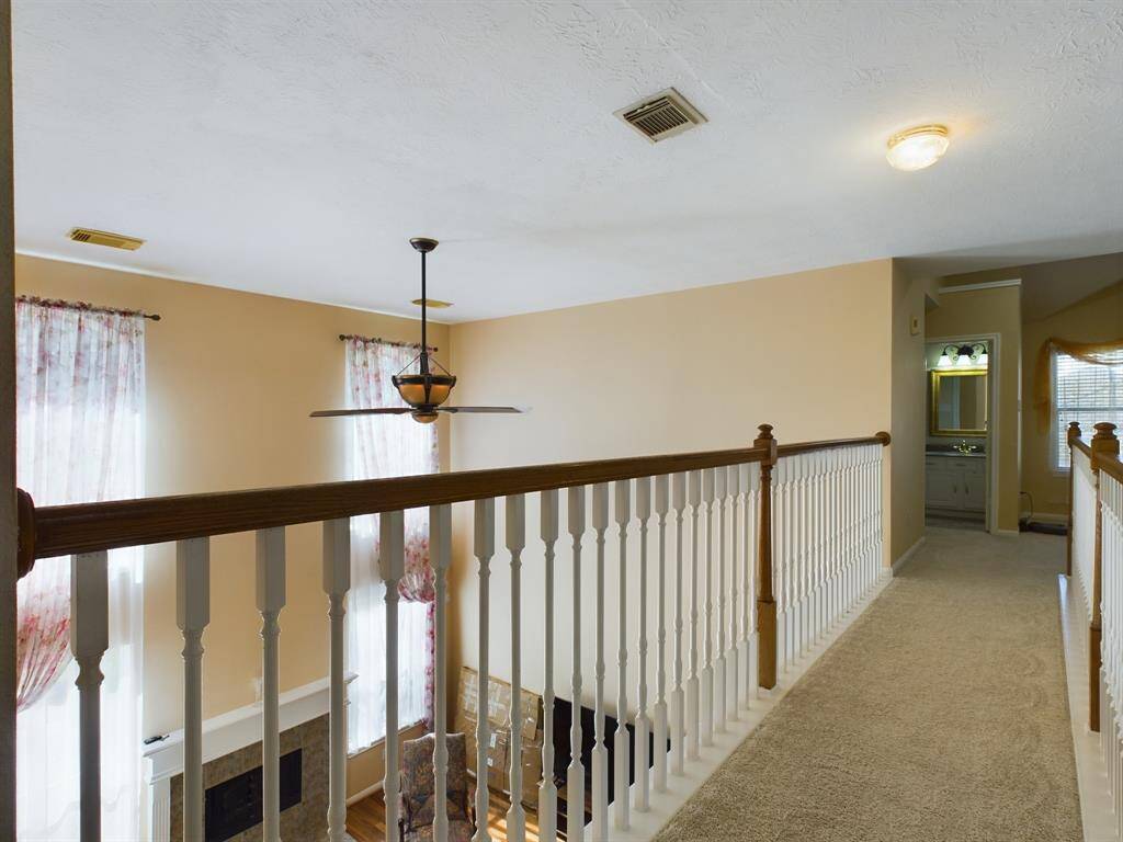 Catwalk overlooks the 2 story living room