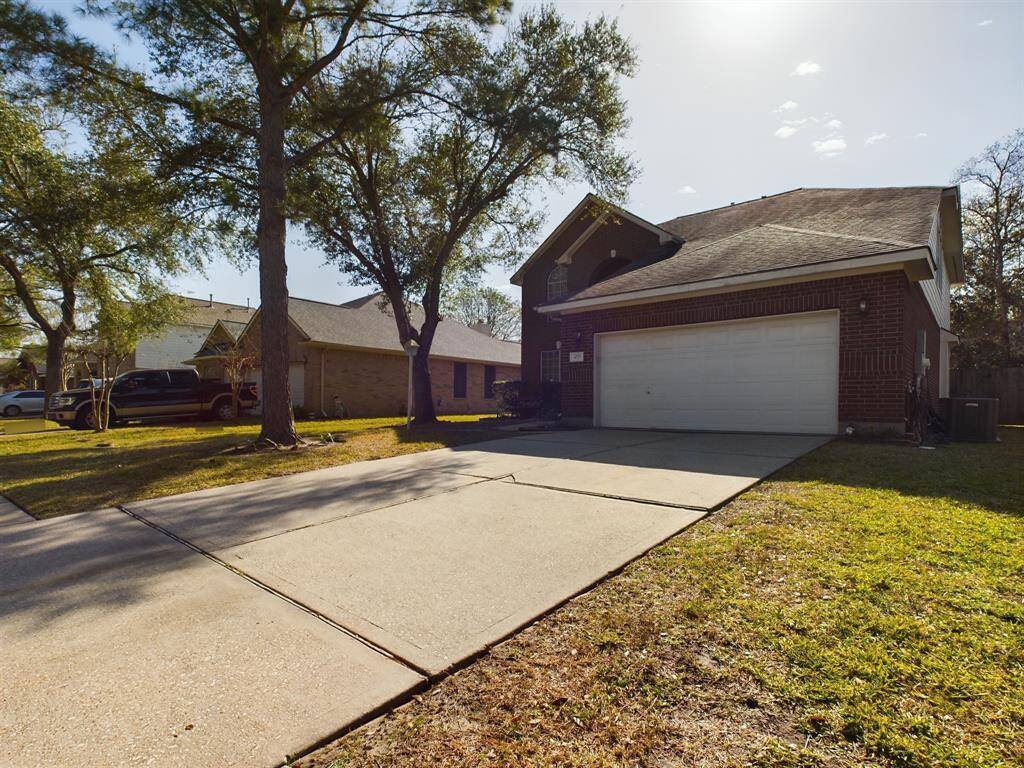 Features mature trees, providing shade. The long driveway provides plenty of parking