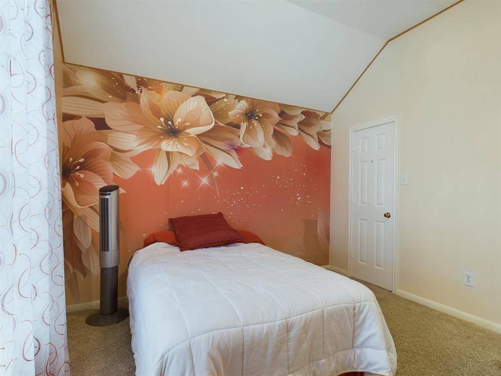 Spare bedroom creates a warm and inviting atmosphere