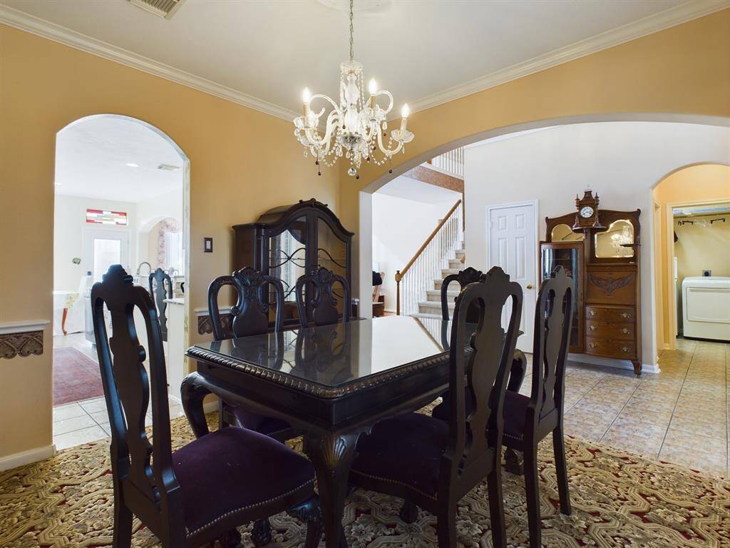 The room is connected to adjacent to the kitchen through arched doorway