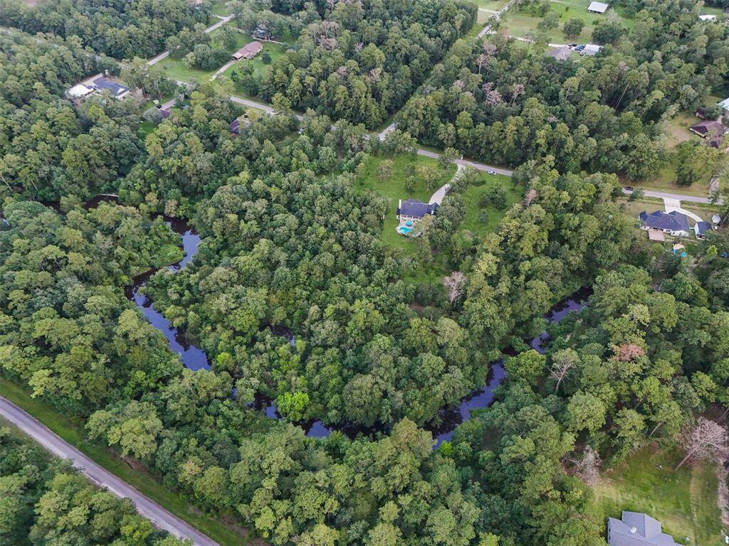Aerial of Long John Creek property line in back of property.