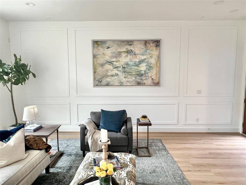 Statement wood-paneled walls bring refined texture and architectural character.