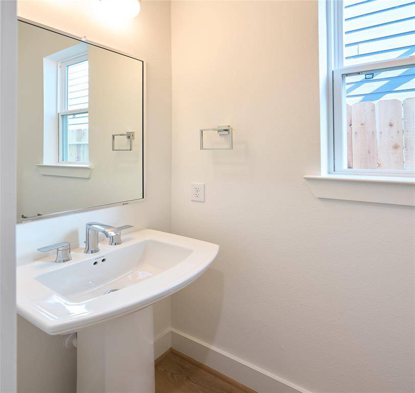 Stylish half-bath with modern fixtures and finishes.?