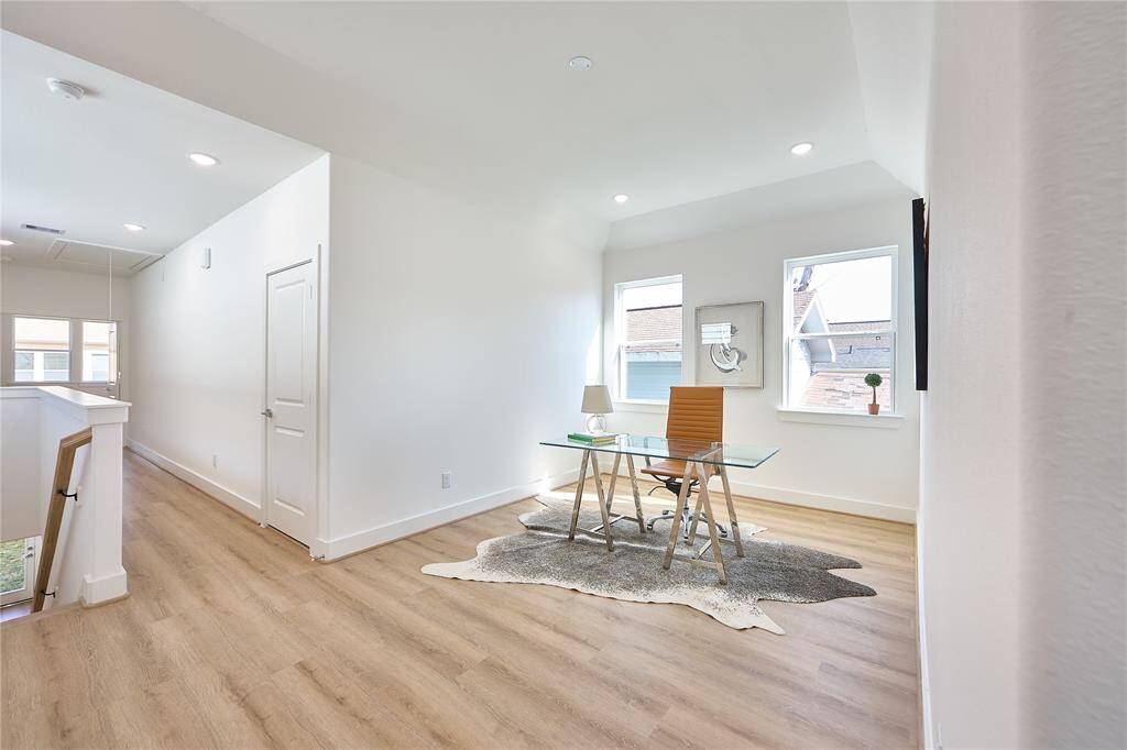 Versatile loft space suitable for a media room or play area.?