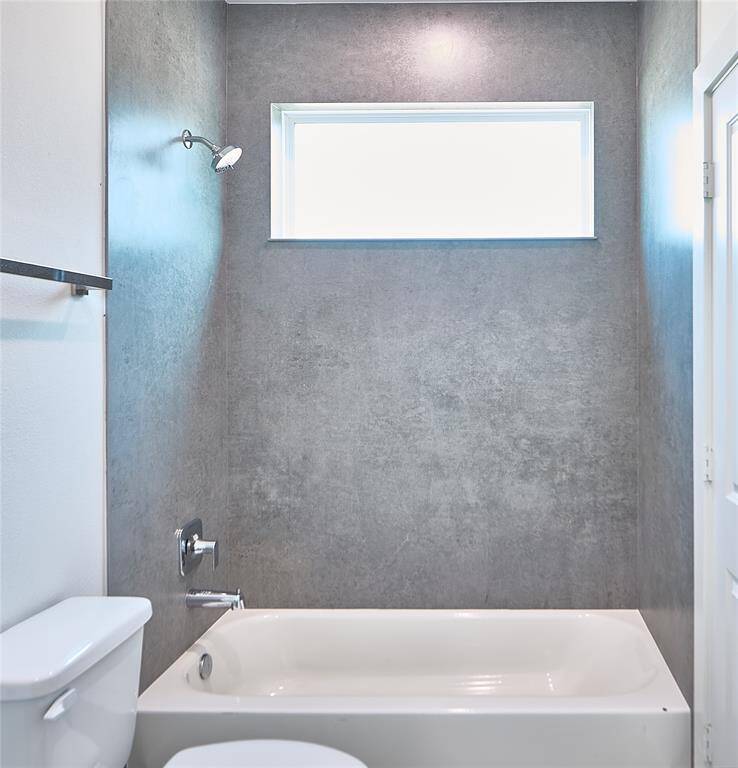A chic and modern design with stunning tile work that elevates the entire bathroom.