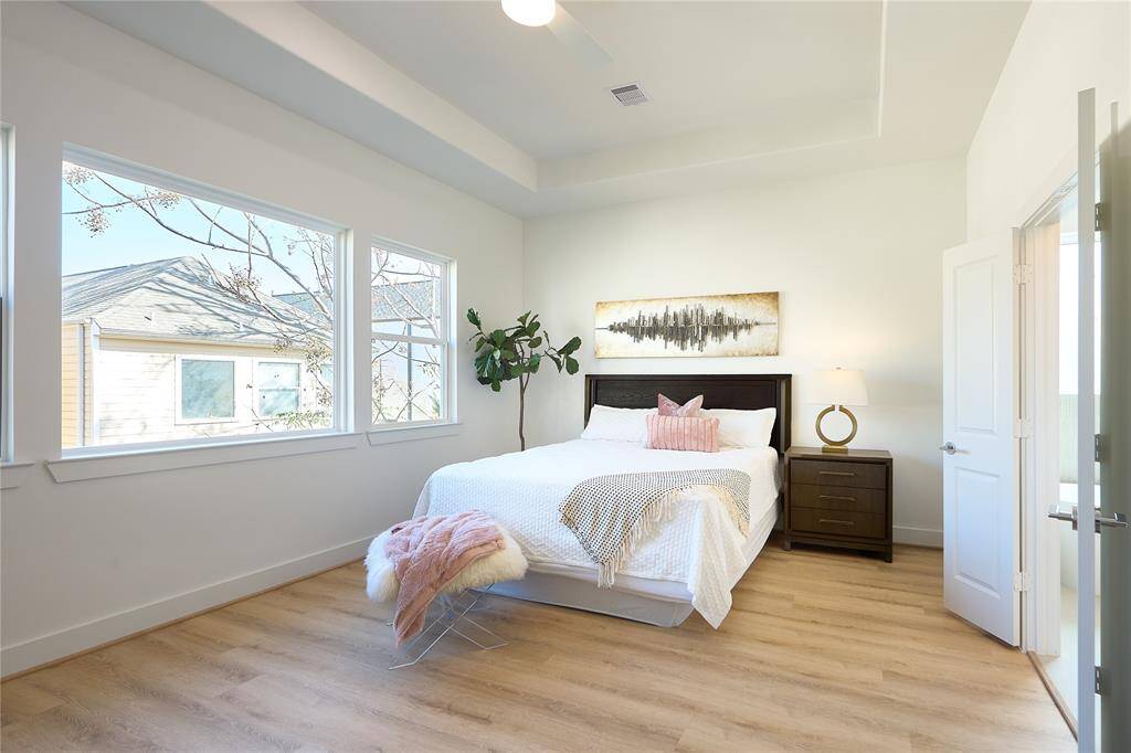 Luxurious primary suite with ample space and natural light.?