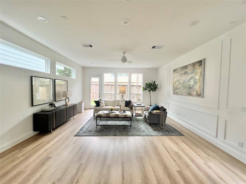 Tailored millwork elevates the living room with a sophisticated, designer touch.