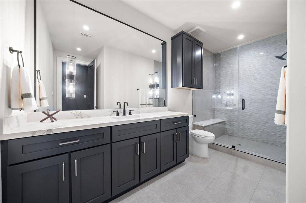 A full private bathroom is located inside the current office.  This hallway as you enter this space has a custom-built wardrobe if this room better suits your needs as a bedroom.