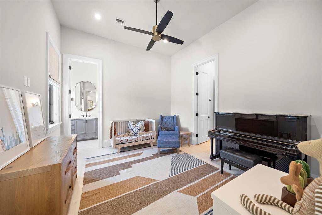 First floor flex room currently being used as a bedroom/nursery.  It can be accessed through the primary wardrobe also making it a fantastic space for an exercise room. This room has its own closet and an ensuite bathroom.