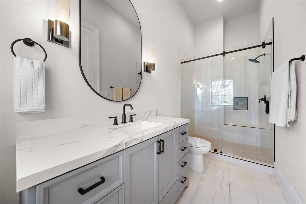 Attached private bathroom for the downstairs nursery/exercise room.