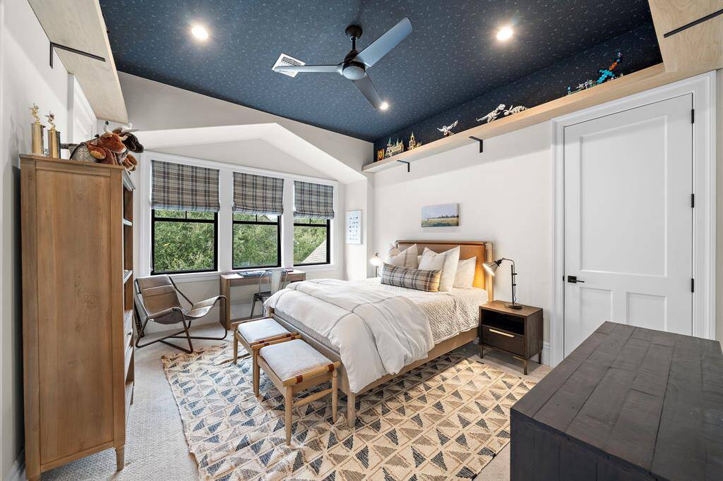 Third bedroom upstairs overlooking the backyard acreage.  This bedroom has an updated ceiling and wrap around display shelves.