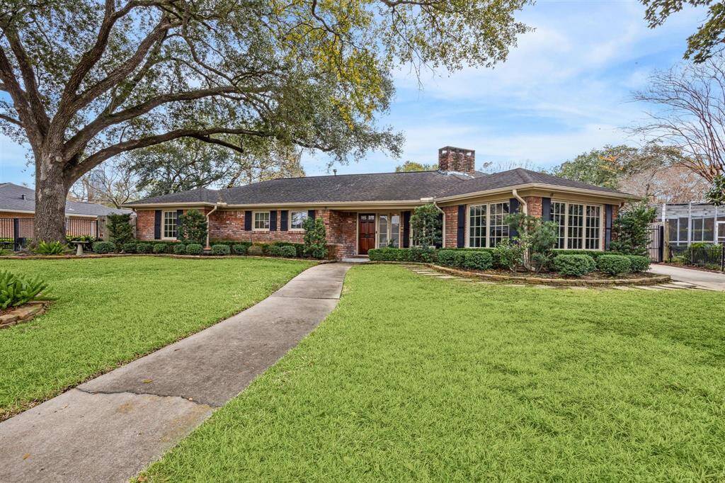 Large front yard complete with beautiful and well maintained oak trees