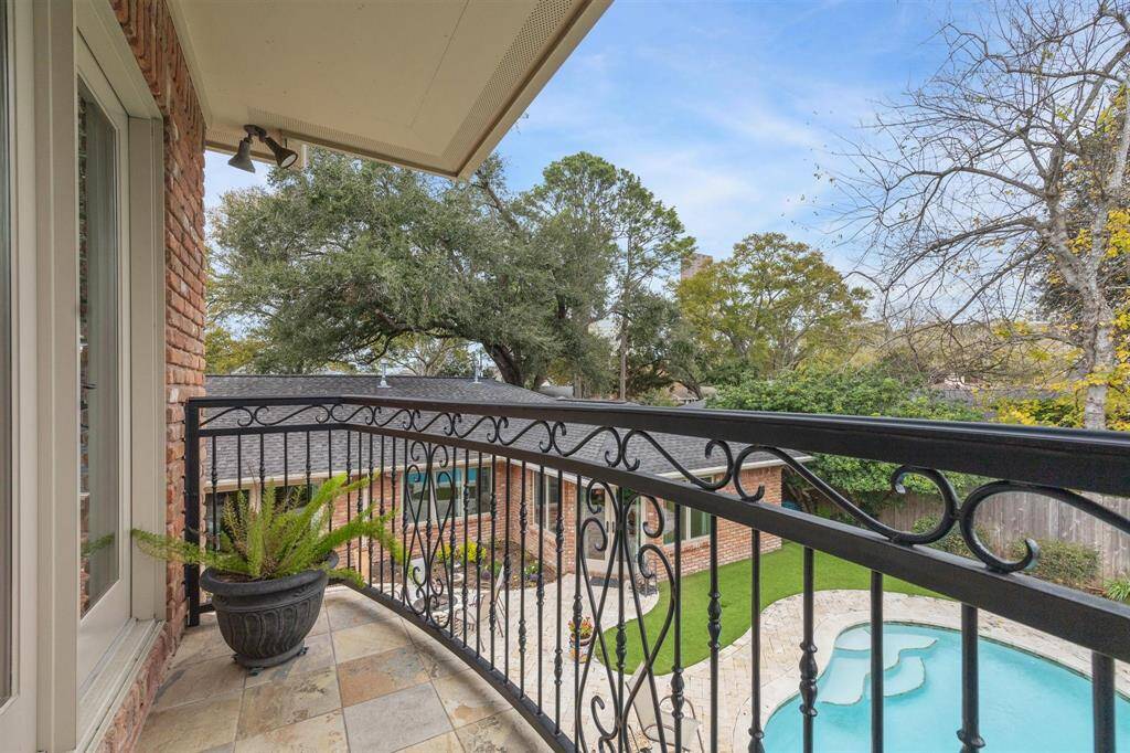 TV/living room upstairs just off bedroom #3 and bathroom #3. Balcony access from this living room that overlooks the pool and backyard