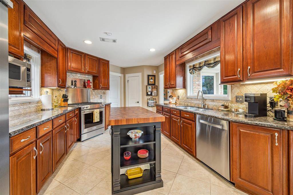 To the right of the entry way, you walk into the open and welcoming living room. To the left of the room is the dining room that can be sectioned off with hidden pocket doors